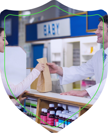 Client at the pharmacy counter receiving a prescription order.